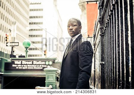 Businessman in full suit at Wall Street subway metro station