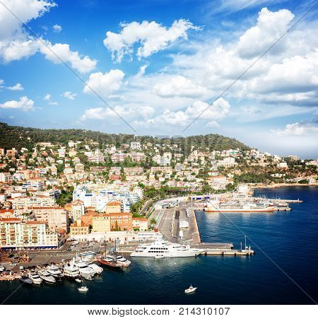 port of Nice and metiterranean sea at summer day under blue sky with cloud, France, retro toned