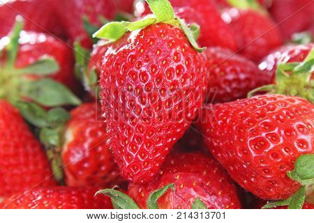 Strawberry background. Red whole strawberry as pattern texture. Strawberries. Sweet