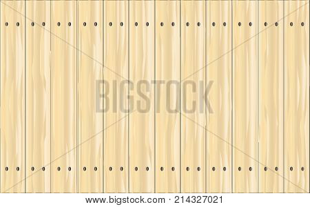 A pine fence made of brightly stained softwood planks showing the wood grain.