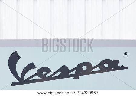 Grenoble, France - June 25, 2017: Vespa logo on a wall. Vespa is an Italian brand of scooter manufactured by Piaggio. The name means wasp in Italian