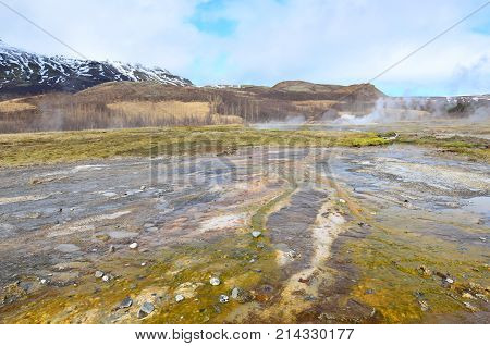 Beautiful Landscape With Minteral Deposits And Steaming Geysers