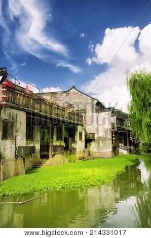Chinese style buildings and a dramatic sky in Xitang town in Jiashan county in Zhejiang province China.