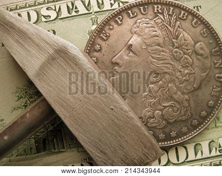 Hammer to forge or to mine coins and bills. Symbol of economy and finance to get profit and income.