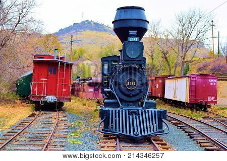 November 6, 2017 in Golden, CO:  Vintage railroad locomotives and rail cars in a stockyard taken at the Colorado Railroad Museum in Golden, CO where people can observe these railroad cars and locomotives upfront