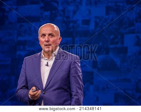 BERLIN GERMANY - NOV 14 2017: NetApp Cloud Business Unit vice president Anthony Lye makes speech at NetApp Insight 2017 conference in Berlin Germany on Nov 14 2017.