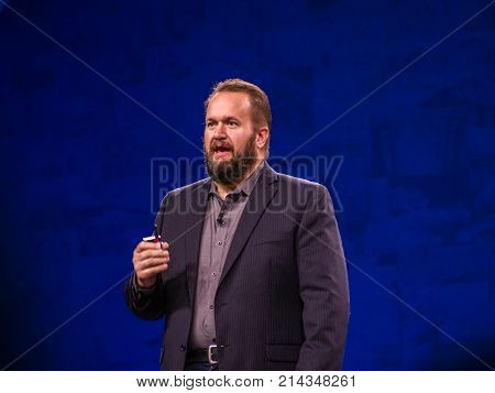 BERLIN GERMANY - NOV 14 2017: NetApp Chief Product Officer Dan Berg makes speech at NetApp Insight 2017 conference in Berlin Germany on Nov 14 2017.