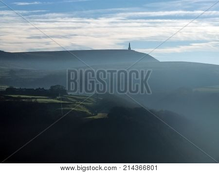 stoodley pike in west yorkshire win morning mist in winter