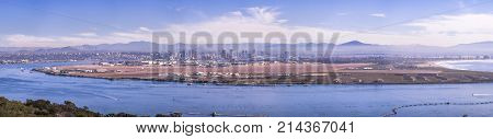 Downtown San Diego cityscape and the bay with boats. San Diego Bay shot from Cabrillo park.