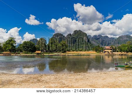 Long Tail Boats On Sunset At Song River, Vang Vieng, Laos.
