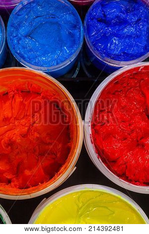 Top View Of Plastisol Ink In White Plastic Cans