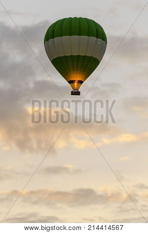 Balloon silhouette in the sunrise sky