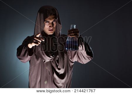 Alchemist doing experiments in alchemy concept