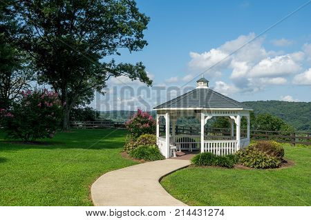 A pavilion or gazebo in a beautiful public garden park.