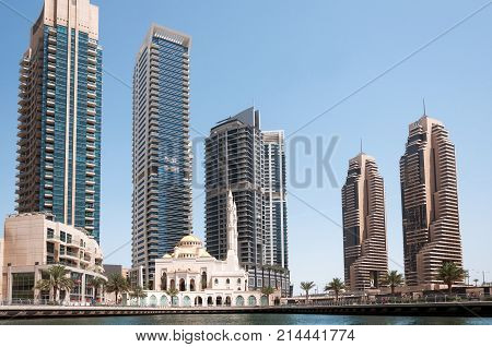 DUBAI, UAE - MAY 5, 2017: Modern buildings and Al Raheem mosque on the marina walk in Dubai Marina on may 5, 2017 Dubai, UAE.
