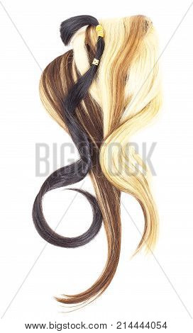 Real woman hair texture. Human hair weft, Dry hair with silky volumes. Real european human hair wallpaper texture. Brown blond dark blonde and black. Photo.
