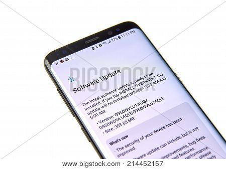 MONTREAL CANADA - NOVEMBER 12 2017: Samsung S8 Software update information on the screen. Samsung Galaxy S8 is one of the most popular cell phones.