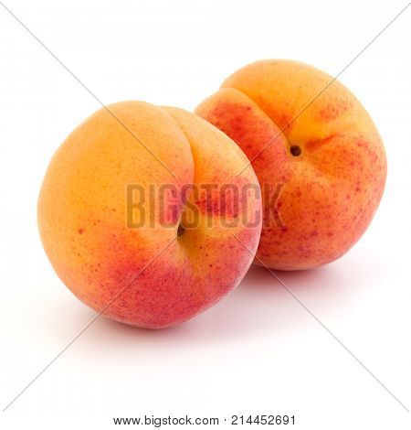 Two apricot fruit isolated on white background cutout