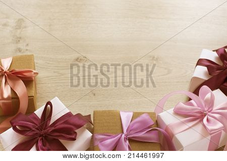 Gift boxes decorated with satin ribbon. The festive lights. Top view flat lay
