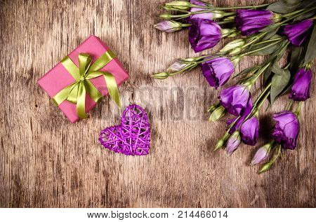 Wicker heart gift and flowers. Valentine's Day. Romantic gift
