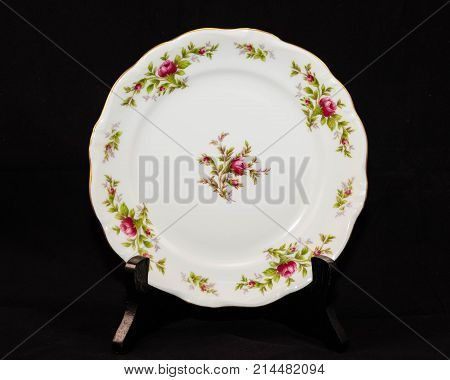 a hand painted rose pattern china dinner plate