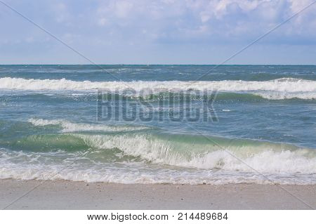 Sea Coast Waves Rolling On Sandy Beach, Stormy Sunrise