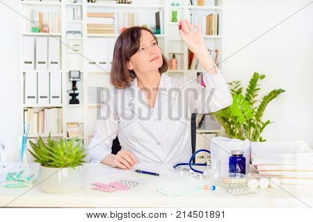 female physician medicine doctor with a stethoscope in the hand at workplace. Medical and health care. blood pressure, heartbit, disease healing, pharmacy, OSH and insurance concept.