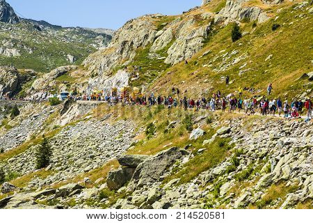 Col de la Croix de Fer France - 25 July 2015: Spectators waiting for the peloton during the passing of The Publicity Caravan on the roadside to the Col de la Croix de Fer in Alps during the stage 20 of Le Tour de France 2015.