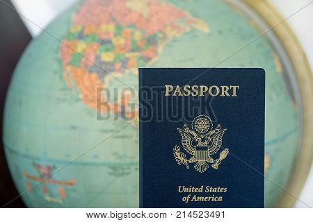 American travel document passport with world background.