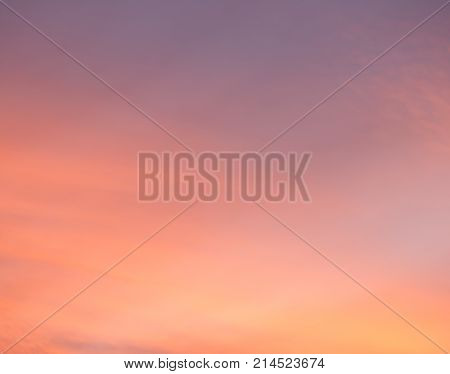 Dramatic sunset sky with warm colors in magenta orange yellow and pink