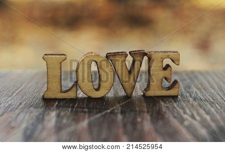 Love word letters. Love wood letters on table. Love wood letters close up. Photo stock.