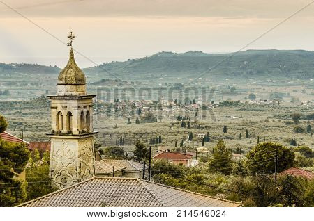closeup of old church steeple landscape of the interior of zakynthos island and horizon with the ionian sea