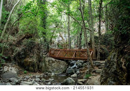 A small wooden bridge over a stream on a way to Caledonia waterfall near Platres central Cyprus