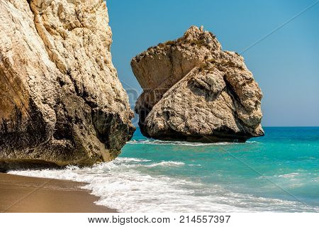 A large rock in a sea next to Aphrodite Rock popular attraction for tourists in Cyprus