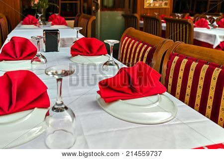 Glasses And Plates On Reserviert Table In Restaurant