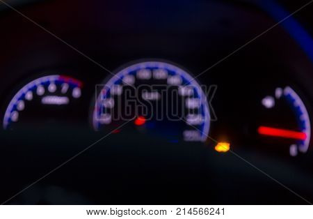 Defocused modern car dashboard. Bokeh background. Concept of drunkenness driving. Over speed