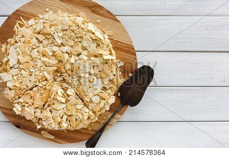 Classic Napoleon cake top view. Traditional millefeuille dessert with puff pastry and custard, russian cuisine treat, copy space