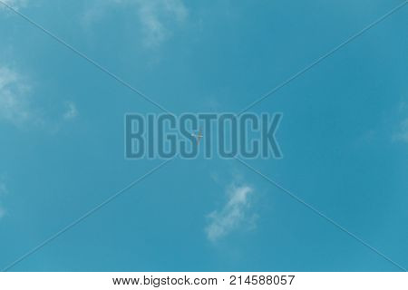 Glider Gliding In Blue Sky From Below