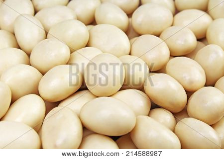 White chocolate balls. White chocolate as background texture pattern. Photo.