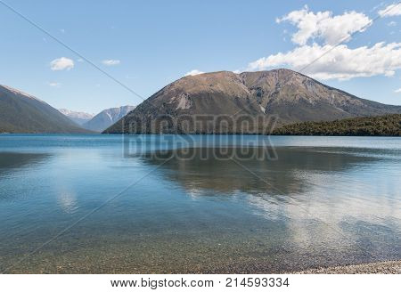 Mount Robert reflecting in lake Rotoiti in Nelson Lakes National Park, New Zealand