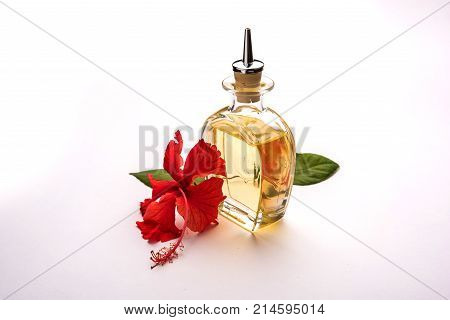 Jaswand or Hibiscus oil and bath soap/shampoo with flower and Reetha fruit and white towel