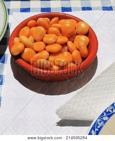 Plate of lupine beans, snack. close up photo