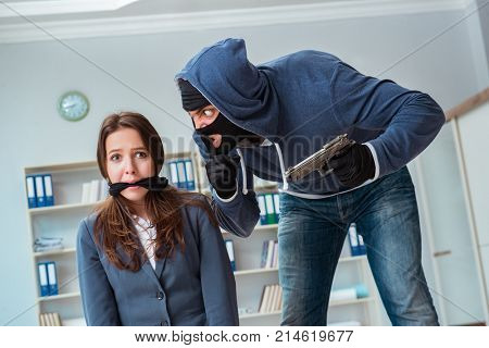 Criminal taking businesswoman as hostage in office