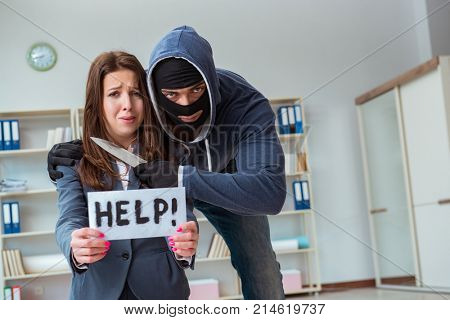 Criminal taking businesswoman as hostage in office