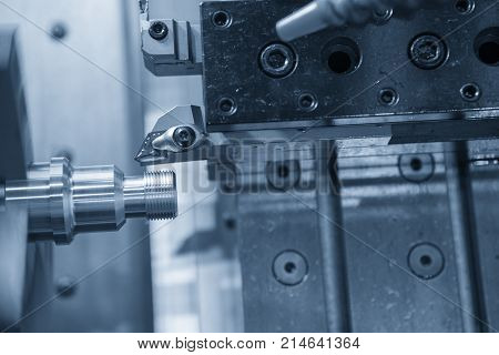 CNC lathe machine (Turning machine) cutting the metal screw thread part with the cooling tube .the cnc cooling component with the sample part.