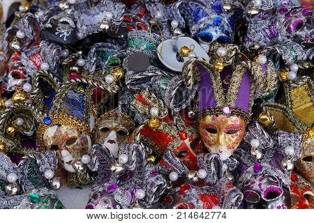 Colorful carnival masks on the market in Venice, Italy. Masks were worn in Venice to disguise the wearer from illicit activities:gambling, dancing, affairs or even political assignation