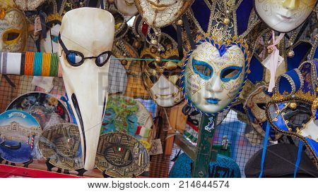 Colorful carnival masks on the market in Venice, Italy. Masks were worn in Venice to disguise the wearer from illicit activities:gambling, dancing, affairs or even political assignation