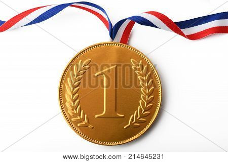 Large gold first prize medal with ribbon