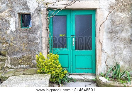 Green Entrance Door To A House On Stone Street In Istria, Croati