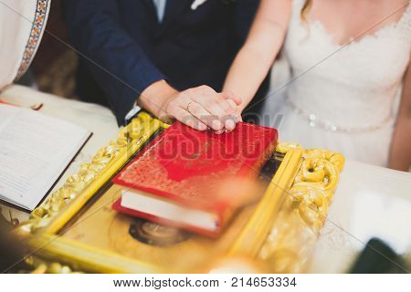 Wedding couple bide and groom get married in a church.